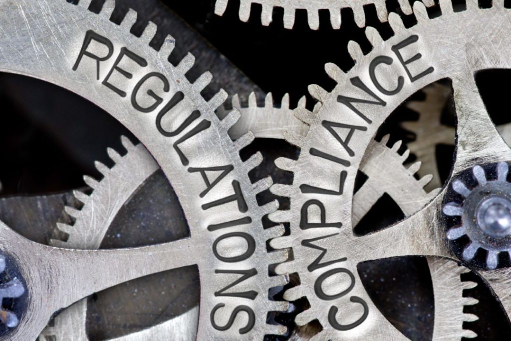 Gears that read Compliance and Regulations